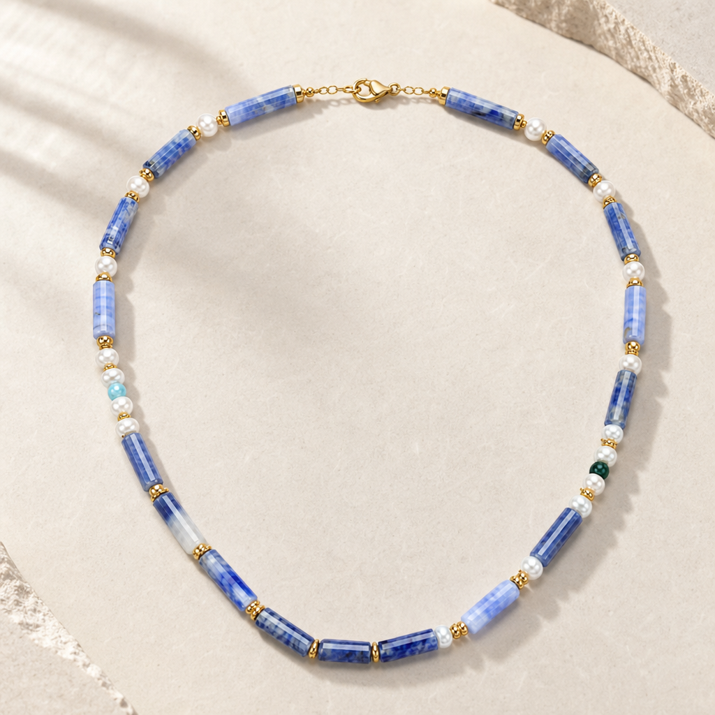 Blue chalcedony and freshwater pearl necklace hero image with warm gold-tone accents.