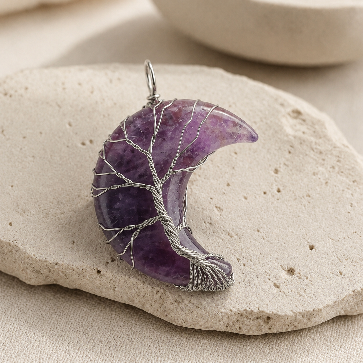 Amethyst moon pendant with Tree of Life wire detail on limestone.