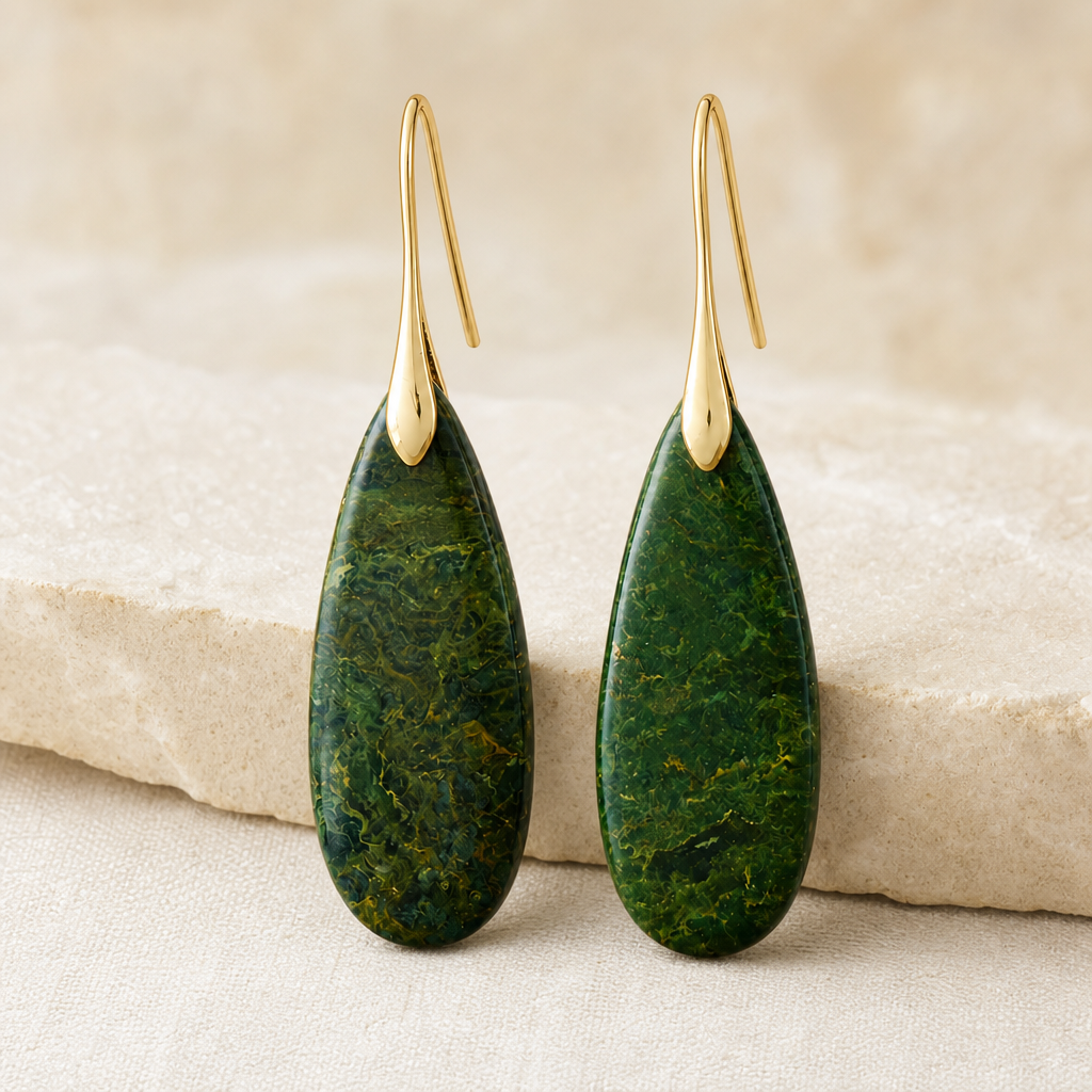 Gold green natural stone waterdrop earrings in soft studio light.