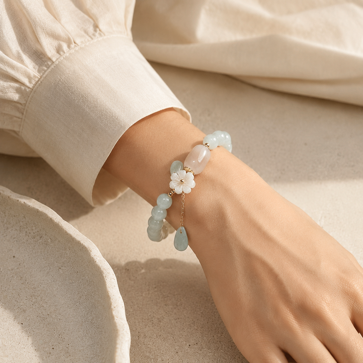 Shell Flower Jade Water Drop Bracelet worn at the wrist.