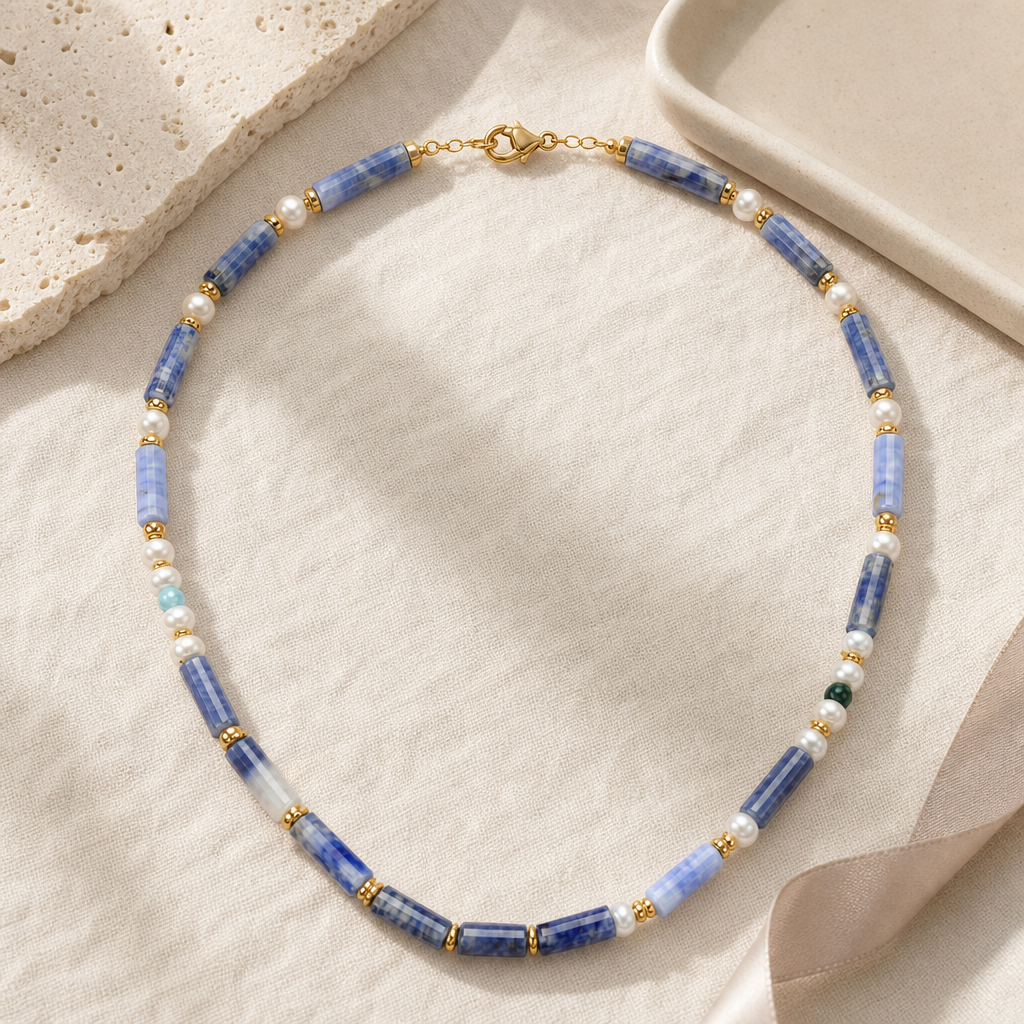 Gift-ready still life of the blue chalcedony and freshwater pearl necklace.